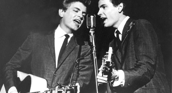 FILE - In this July 31, 1964 file photo The Everly Brothers, Phil, left, and Don, perform on stage. Don Everly, one-half of the pioneering rock ‘n’ roll Everly Brothers whose harmonizing country rock hits impacted a generation of rock music, has died.  Don Everly was 84. A family spokesperson said Everly died at his home in Nashville, Tennessee on Saturday, Aug. 21, 2021. (AP Photo, File)