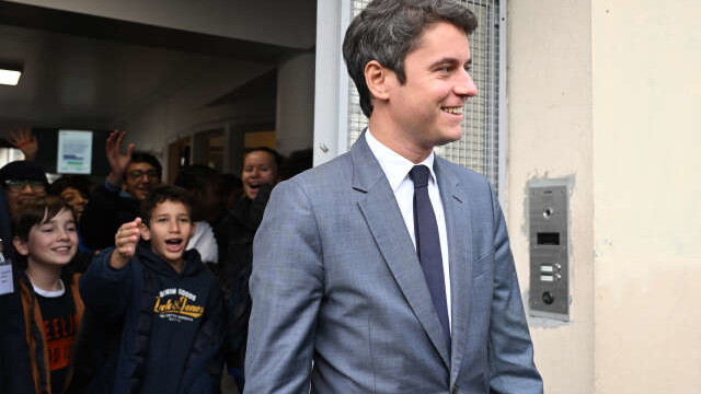 French Education and Youth Minister Gabriel Attal is cheered by pupils during his visit to a Paris' middle-school on the theme of school bullying to mark France's national day against school harassment in  Paris, on November 9, 2023. (Photo by Bertrand GUAY / POOL / AFP)